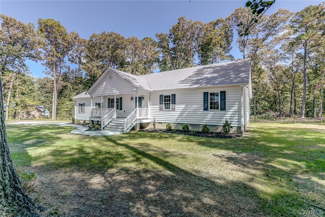 13521 Courthouse Road Dinwiddie, VA 23841 - Photo 2 of 35 a view of a house with a yard patio and fire pit