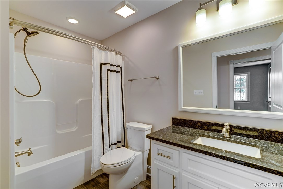 13521 Courthouse Road Dinwiddie, VA 23841 - Photo 24 of 35 a bathroom with a granite countertop sink a toilet and shower