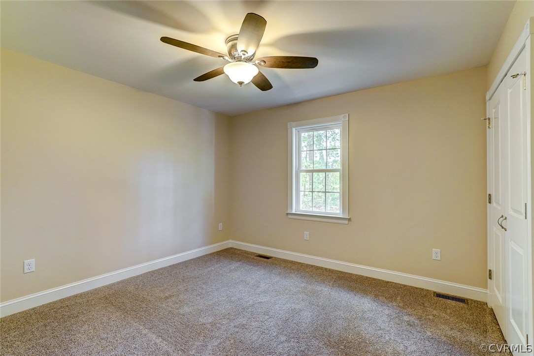 13521 Courthouse Road Dinwiddie, VA 23841 - Photo 25 of 35 an empty room with a window and a fan