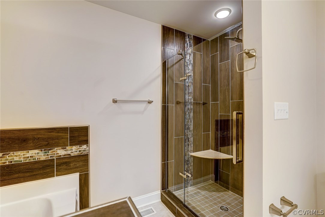 13521 Courthouse Road Dinwiddie, VA 23841 - Photo 30 of 35 a bathroom with a shower and a sink