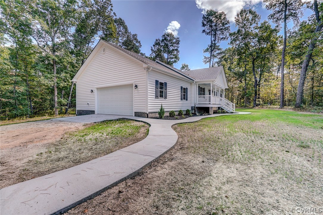 13521 Courthouse Road Dinwiddie, VA 23841 - Photo 3 of 35 a view of a house with a yard and large trees