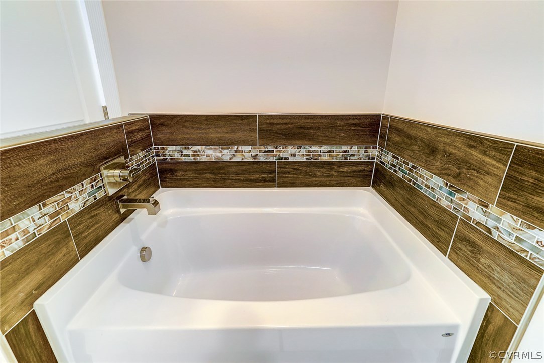 13521 Courthouse Road Dinwiddie, VA 23841 - Photo 31 of 35 a view of a bathtub in a bathroom