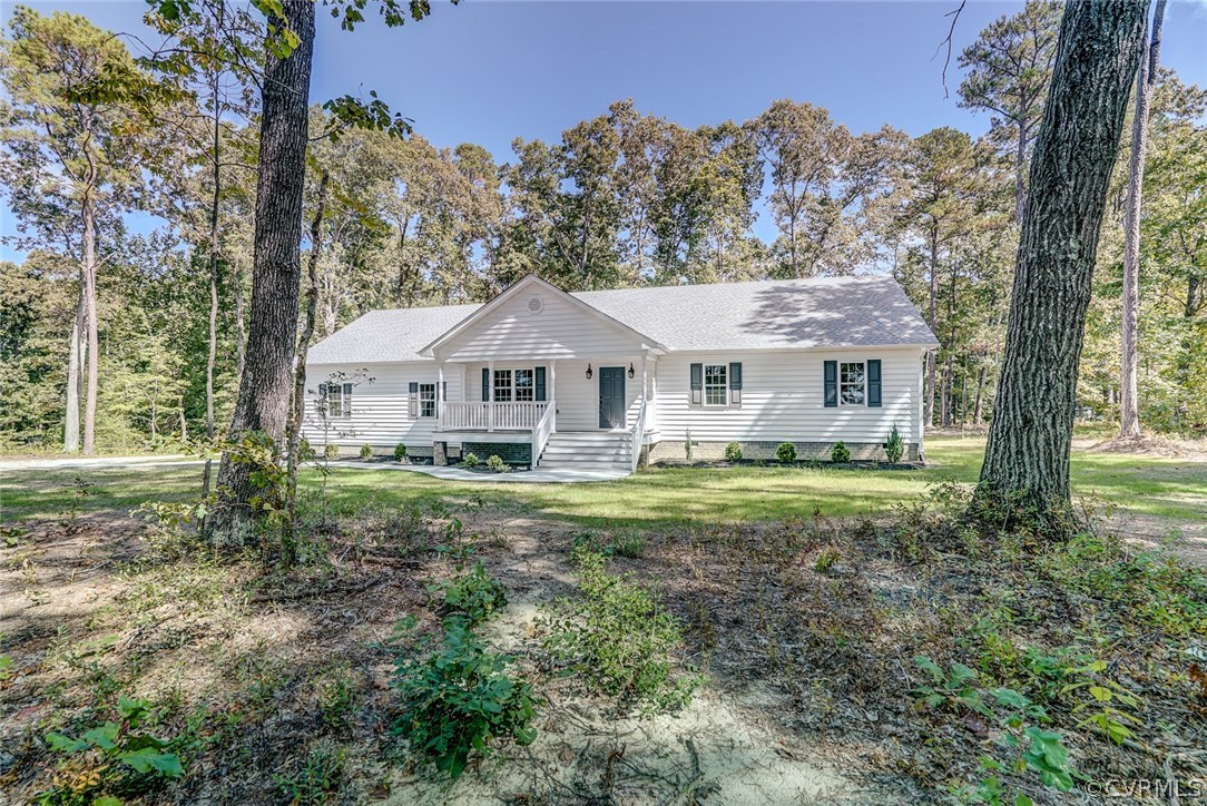 13521 Courthouse Road Dinwiddie, VA 23841 - Photo 35 of 35 a view of a house with a yard and large trees