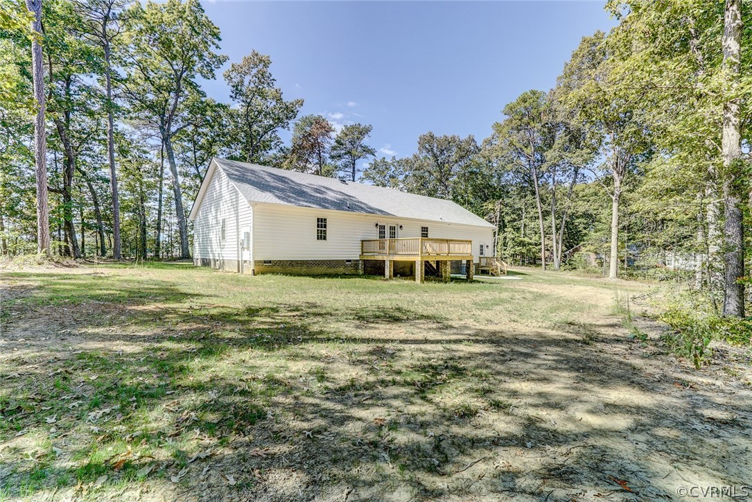 13521 Courthouse Road Dinwiddie, VA 23841 - Photo 5 of 35 a front view of a house with a garden