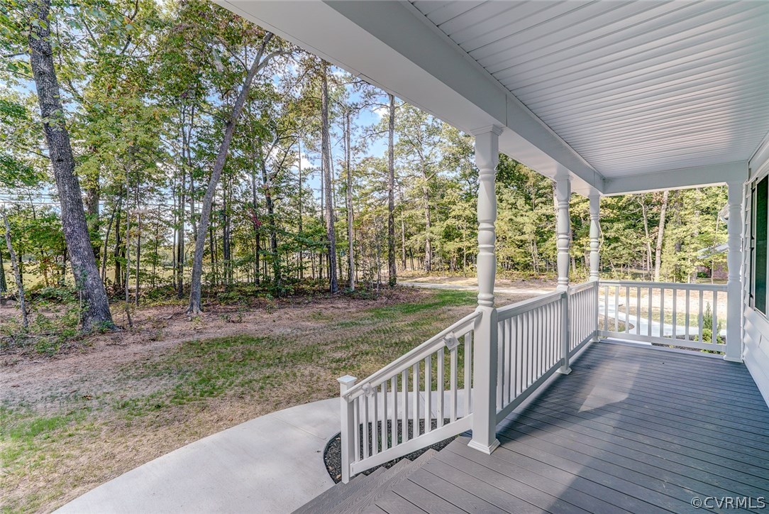 13521 Courthouse Road Dinwiddie, VA 23841 - Photo 6 of 35 a view of deck with trees and wooden fence