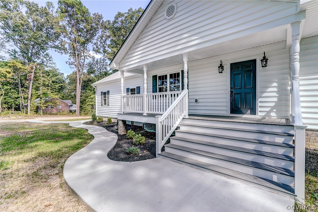 13521 Courthouse Road Dinwiddie, VA 23841 - Photo 7 of 35 a view of a house with backyard and sitting area