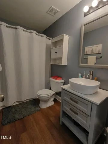 a view of a backyard with swimming pool