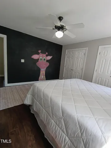 a view of a park with large trees