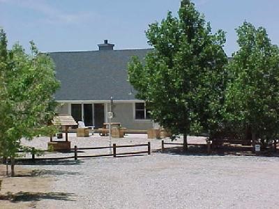 2030 Trinity Road Pinon Hills, CA 92372 - Photo 1 of 1 a view of a house with a backyard