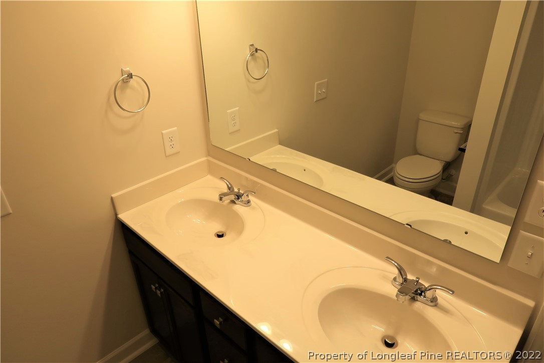 975 Montrose Road Raeford, NC 28376 - Photo 14 of 18 a bathroom with a sink and a mirror