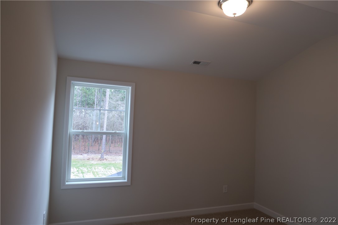 975 Montrose Road Raeford, NC 28376 - Photo 16 of 18 an empty room with a window