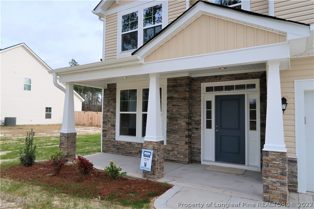 975 Montrose Road Raeford, NC 28376 - Photo 2 of 18 a view of a house with a yard