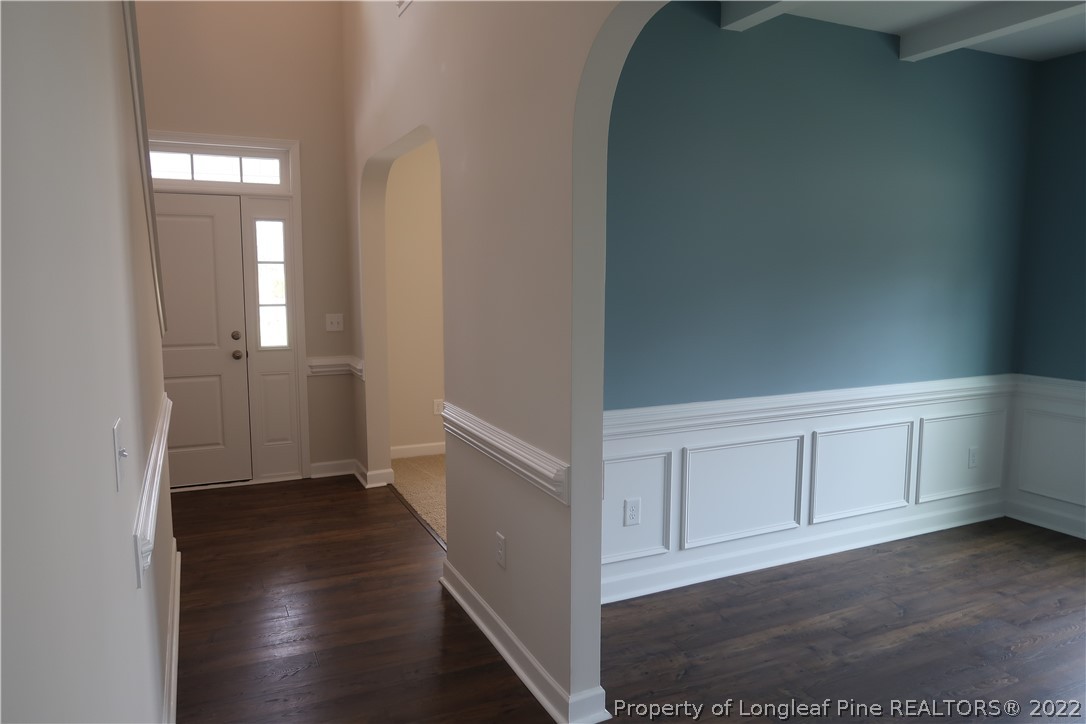 975 Montrose Road Raeford, NC 28376 - Photo 3 of 18 a view of a hallway with wooden floor
