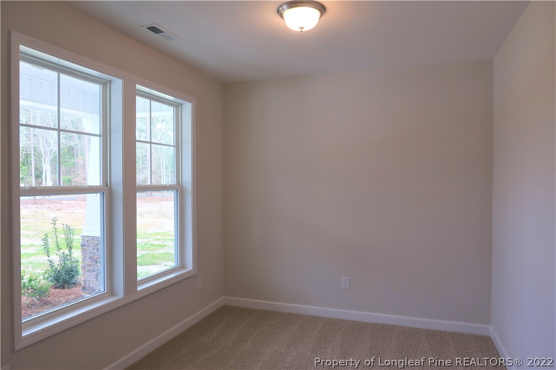 975 Montrose Road Raeford, NC 28376 - Photo 4 of 18 an empty room with a window