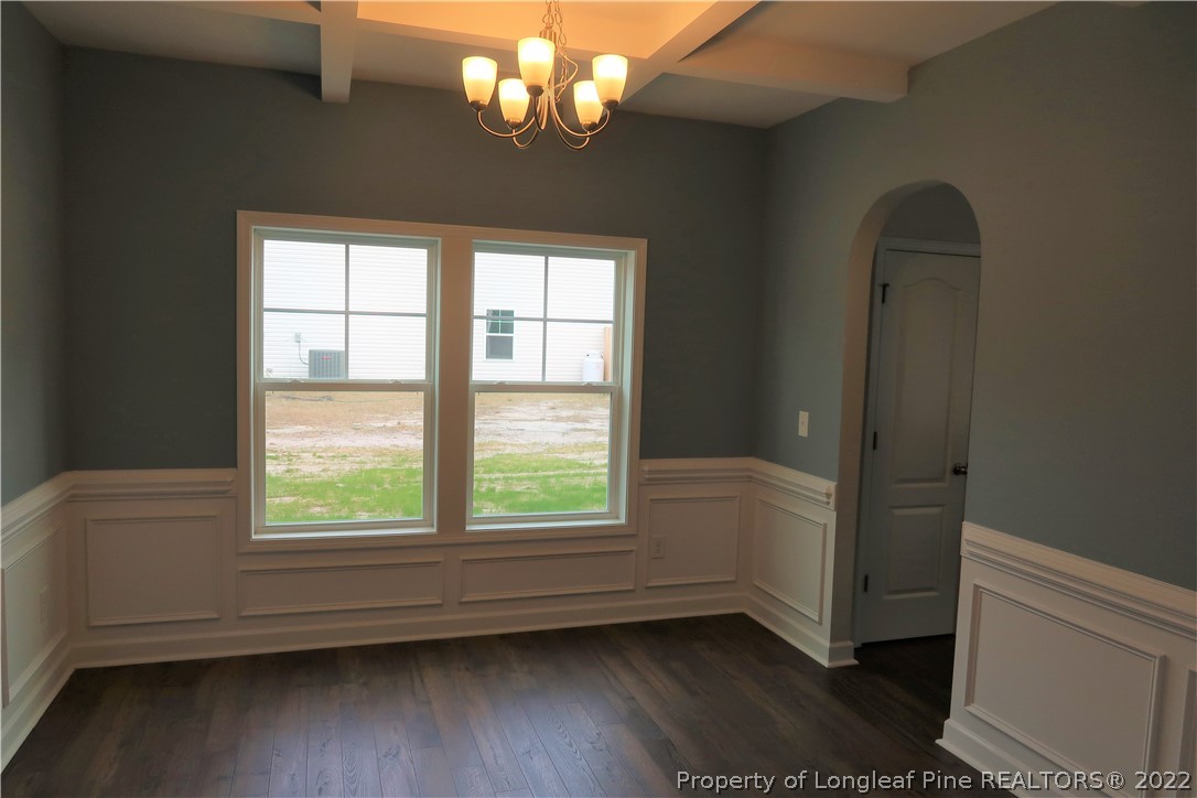 975 Montrose Road Raeford, NC 28376 - Photo 5 of 18 wooden floor in an empty room with a window