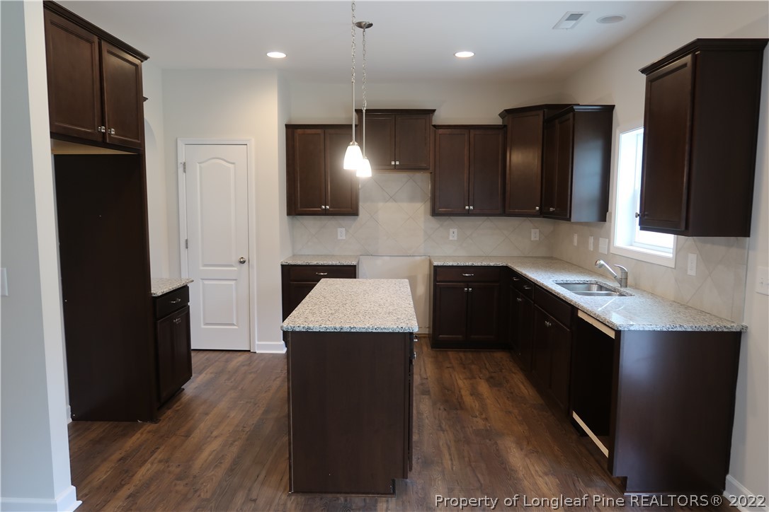 975 Montrose Road Raeford, NC 28376 - Photo 6 of 18 a kitchen with a sink and a refrigerator