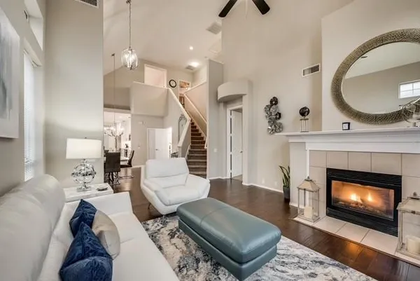 a living room with furniture and a fireplace