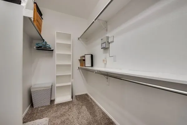 a view of an empty walk in closet