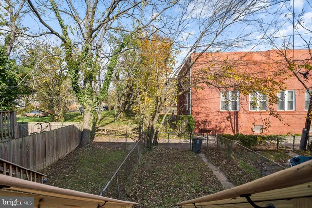 a view of a yard and car parked