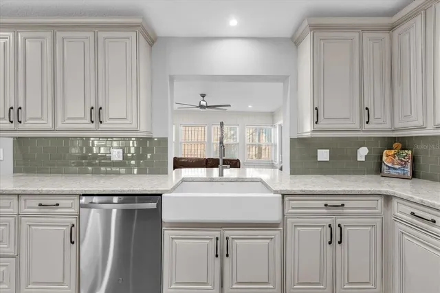 a kitchen with appliances cabinets and a counter top space