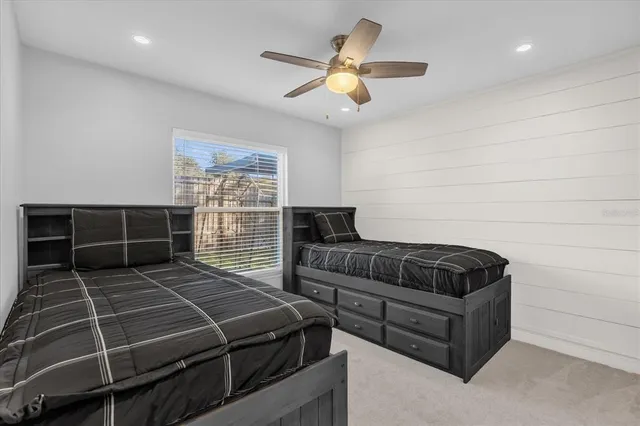 a bedroom with a bed and window