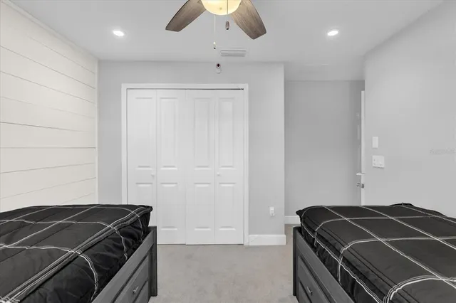 a room with a air conditioner duct and air conditioner