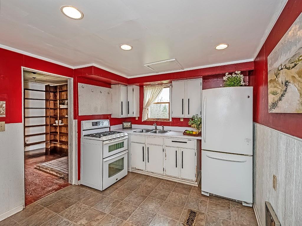 1283 Martin Road Apollo, PA 15613 - Photo 12 of 24 a kitchen with a stove a refrigerator and a sink