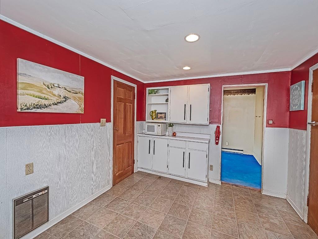 1283 Martin Road Apollo, PA 15613 - Photo 14 of 24 a kitchen with cabinets and wooden floor