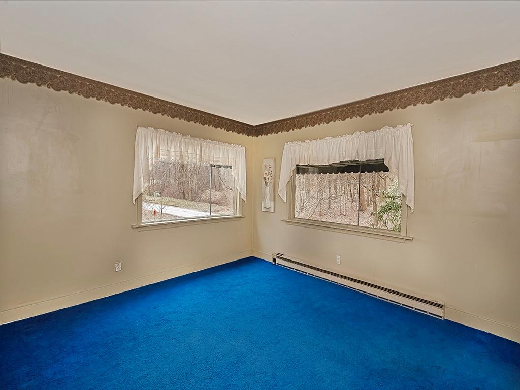 1283 Martin Road Apollo, PA 15613 - Photo 17 of 24 a view of an empty room with wooden floor and a window