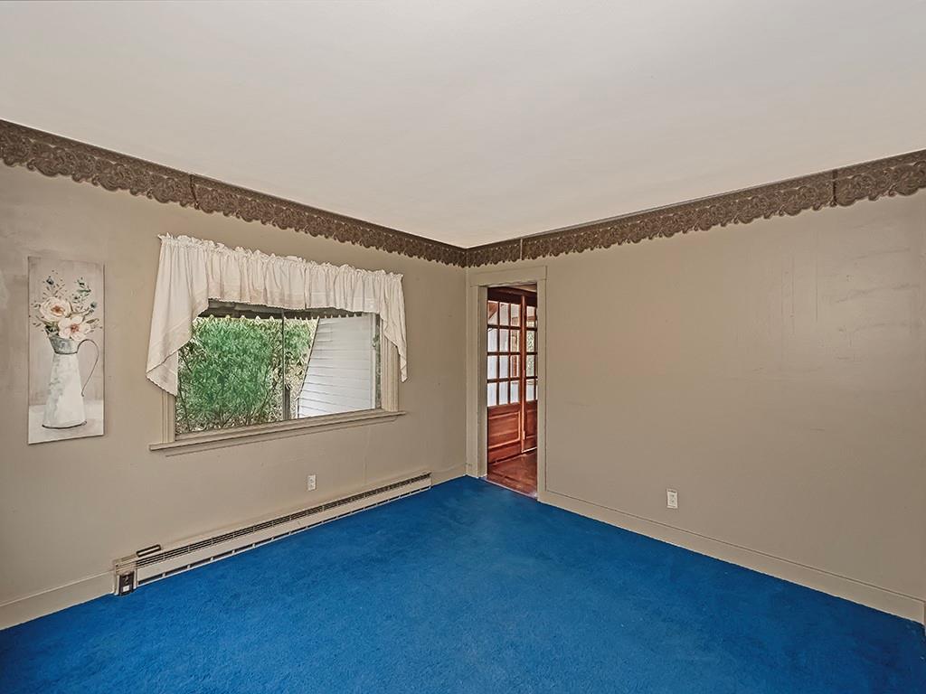 1283 Martin Road Apollo, PA 15613 - Photo 18 of 24 a view of an empty room with a window and wooden floor