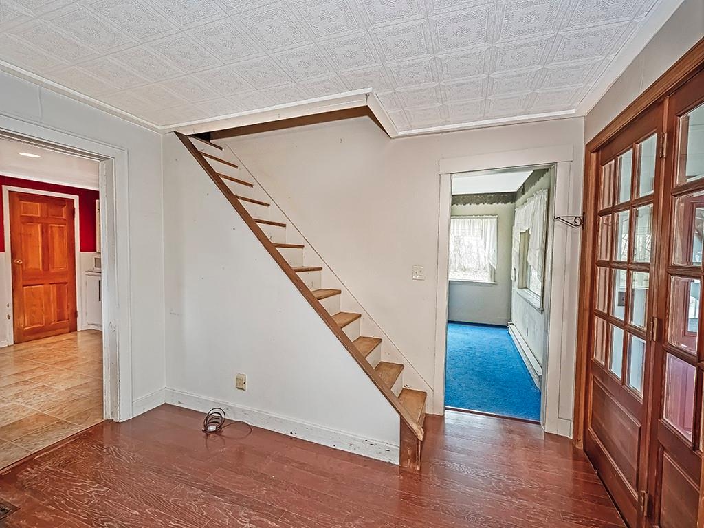 1283 Martin Road Apollo, PA 15613 - Photo 19 of 24 a view of an entryway with wooden floor and stairs