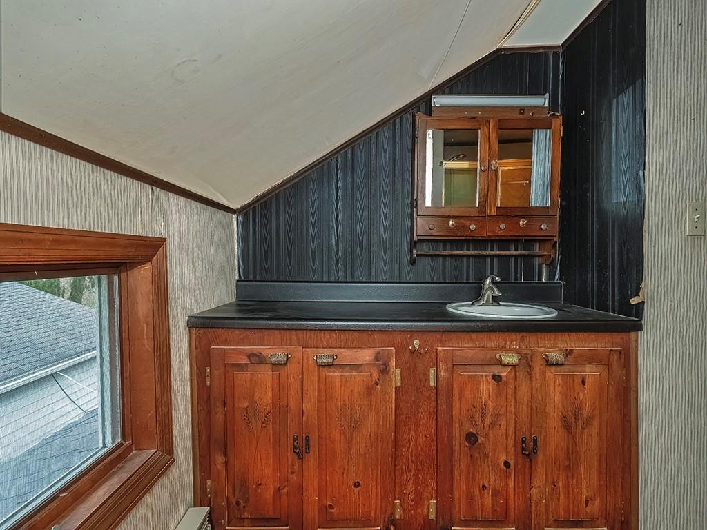 1283 Martin Road Apollo, PA 15613 - Photo 20 of 24 a bathroom with a sink a mirror and a window