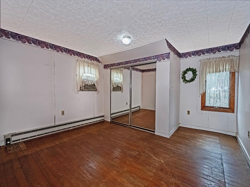 1283 Martin Road Apollo, PA 15613 - Photo 23 of 24 a view of an empty room with windows and hardwood floor