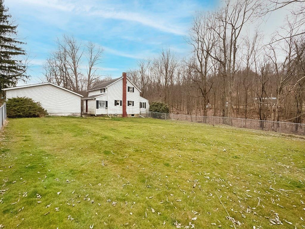 1283 Martin Road Apollo, PA 15613 - Photo 6 of 24 a view of a yard with a house in the background