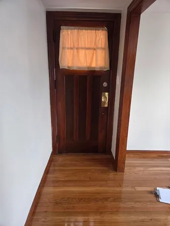 a view of entryway with wooden floor