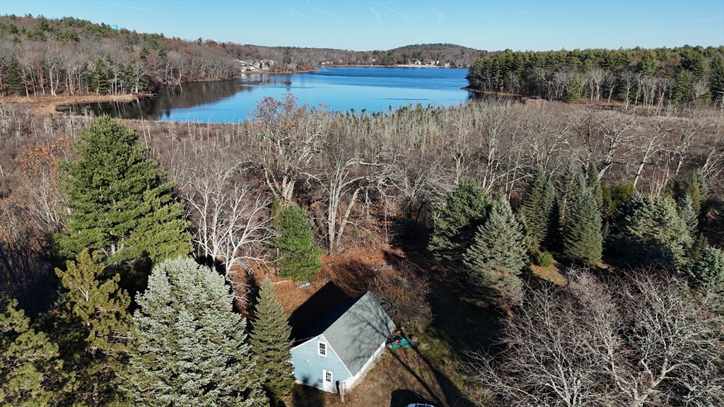 146 Tahattawan Road Littleton, MA 01460 - Photo 12 of 16 a view of a lake with a mountain in the background