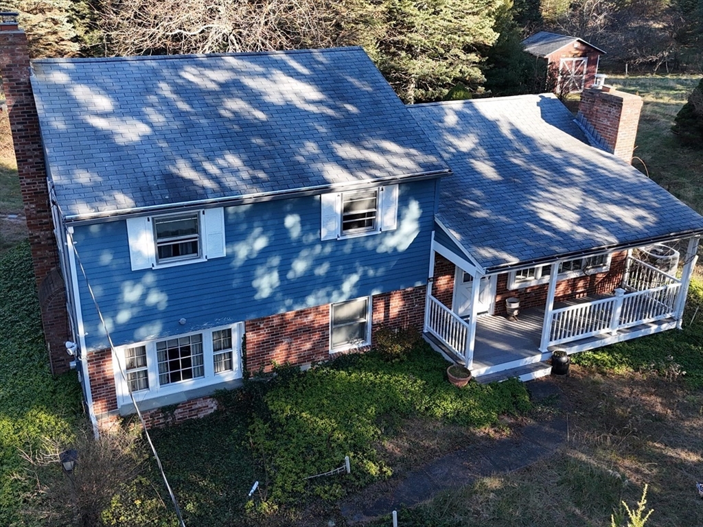 146 Tahattawan Road Littleton, MA 01460 - Photo 2 of 16 a view of a house with a yard