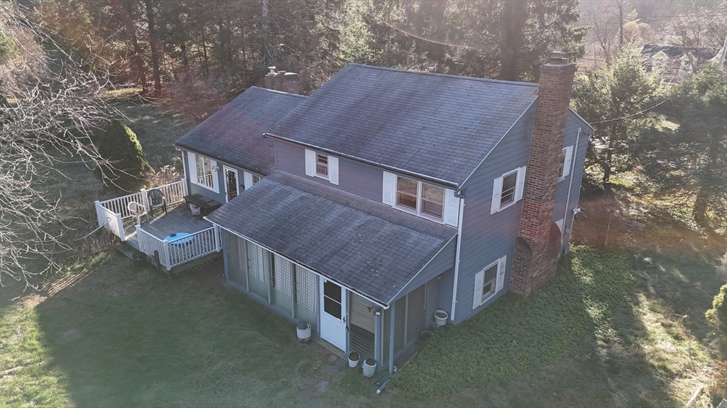 146 Tahattawan Road Littleton, MA 01460 - Photo 4 of 16 a aerial view of a house with a yard