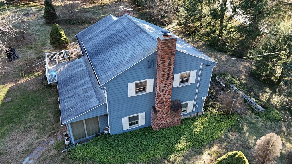 146 Tahattawan Road Littleton, MA 01460 - Photo 5 of 16 a view of a house with a yard