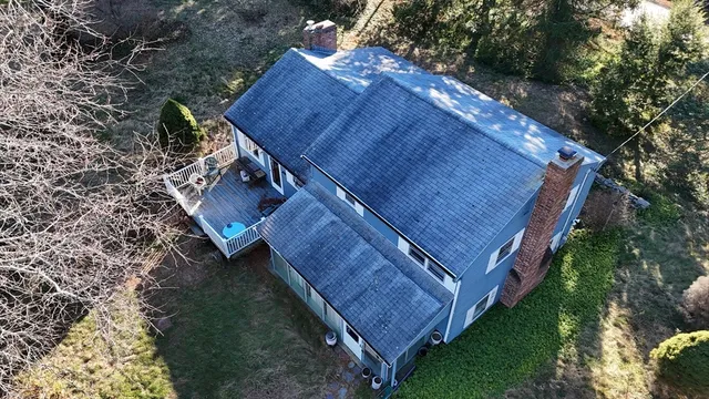 a view of a backyard with tree s