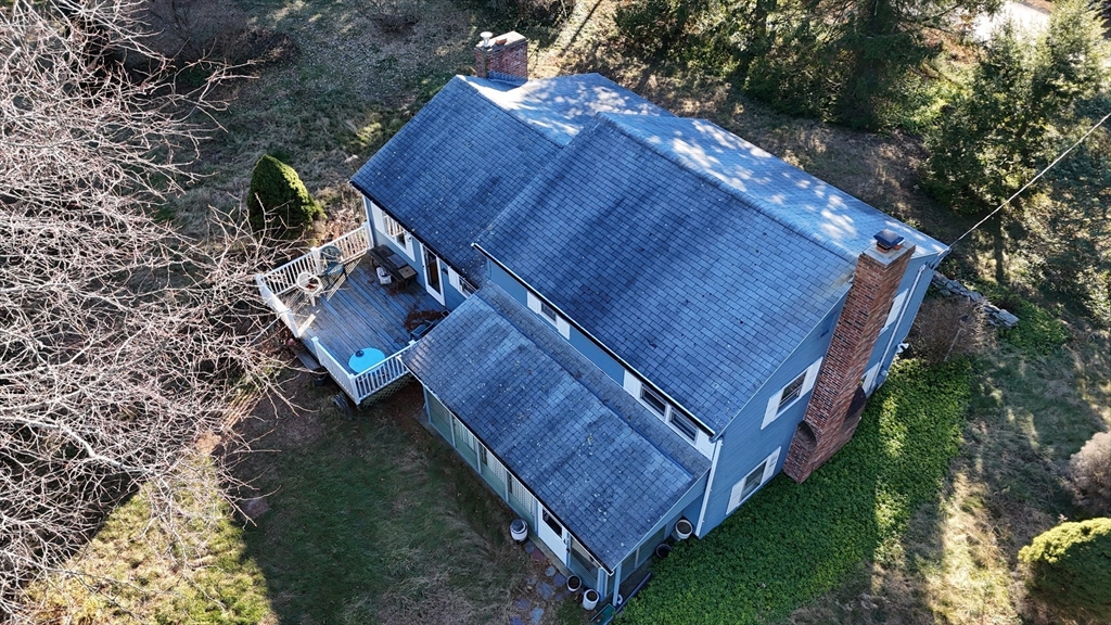 146 Tahattawan Road Littleton, MA 01460 - Photo 6 of 16 a view of a backyard with plants