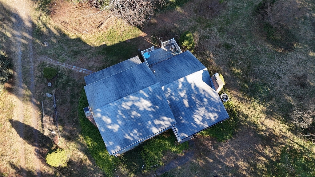 146 Tahattawan Road Littleton, MA 01460 - Photo 7 of 16 a view of a backyard with tree s