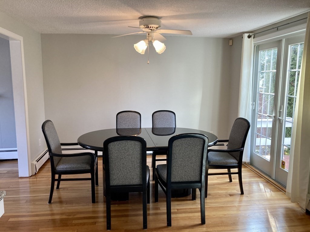 119 Westmoor Road Boston, MA 02132 - Photo 12 of 22 a view of a dining room with furniture and wooden floor