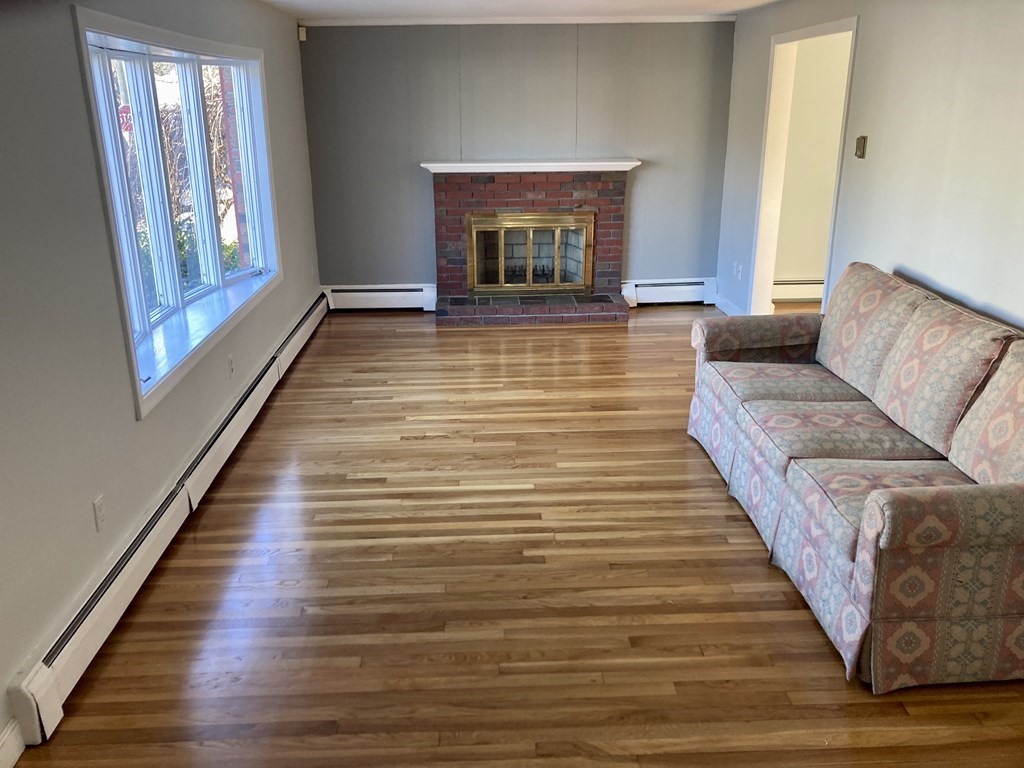 119 Westmoor Road Boston, MA 02132 - Photo 2 of 22 a living room with furniture and a fireplace