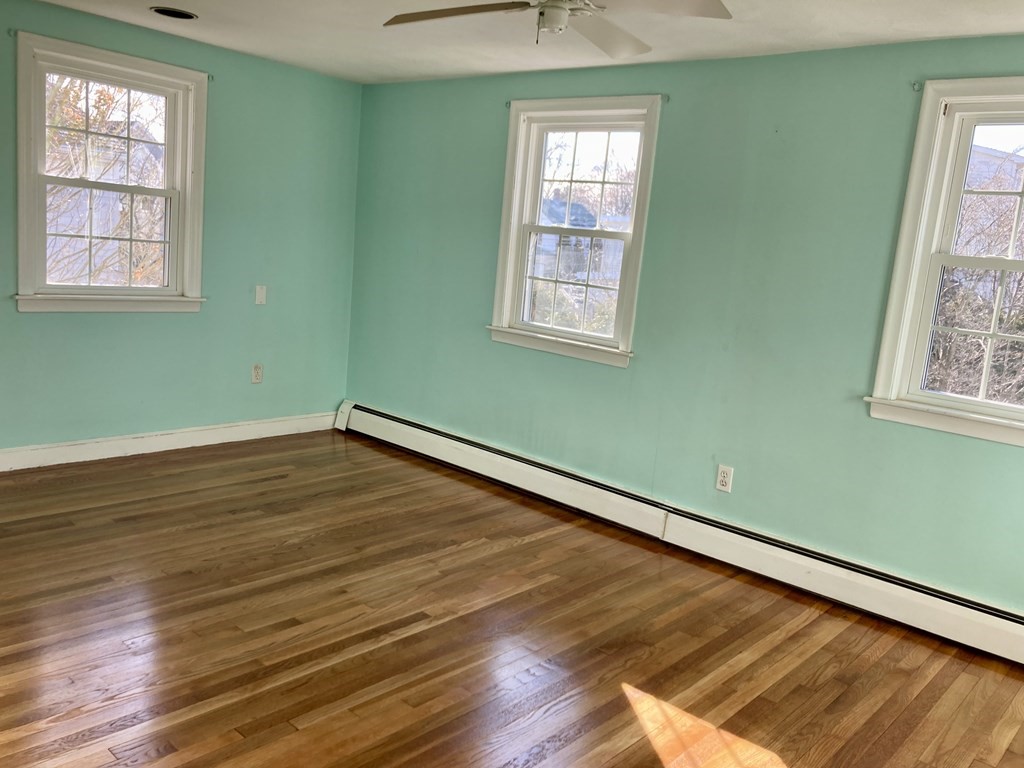 119 Westmoor Road Boston, MA 02132 - Photo 4 of 22 a view of a room with wooden floor and windows