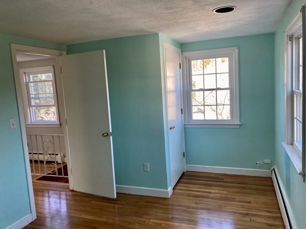 119 Westmoor Road Boston, MA 02132 - Photo 8 of 22 a view of empty room with wooden floor and fan