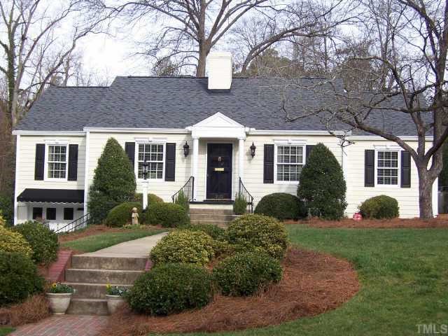 3122 Georgian Terrace Raleigh, NC 27607 - Photo 1 of 12 a front view of a house with garden and trees