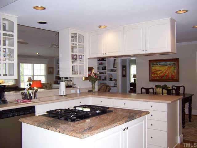 3122 Georgian Terrace Raleigh, NC 27607 - Photo 5 of 12 a kitchen with a sink a stove and cabinets