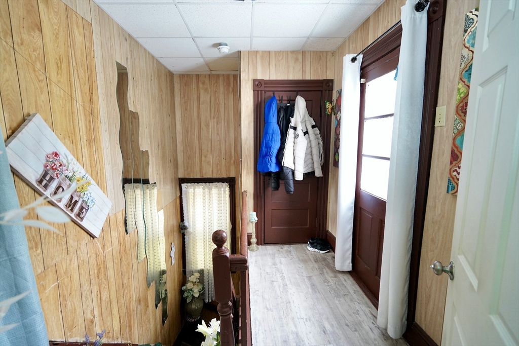 183 Farnham Street Lawrence, MA 01843 - Photo 11 of 38 a view of hallway with furniture and wooden floor