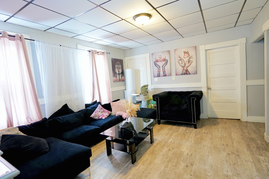 183 Farnham Street Lawrence, MA 01843 - Photo 12 of 38 a living room with furniture and a fireplace